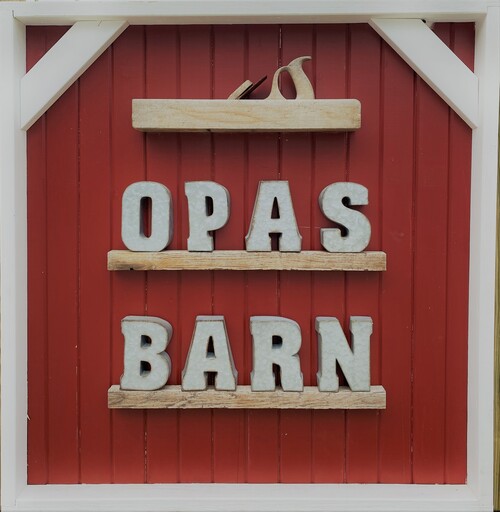 Sign stating the name Opa's Barn